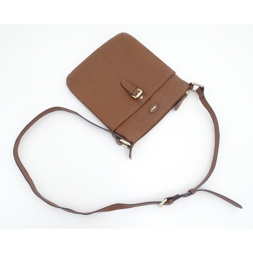 1401 - Vintage fashion / clothing: A Paul Costelloe leather cross body handbag in tan with buckle detail on... 