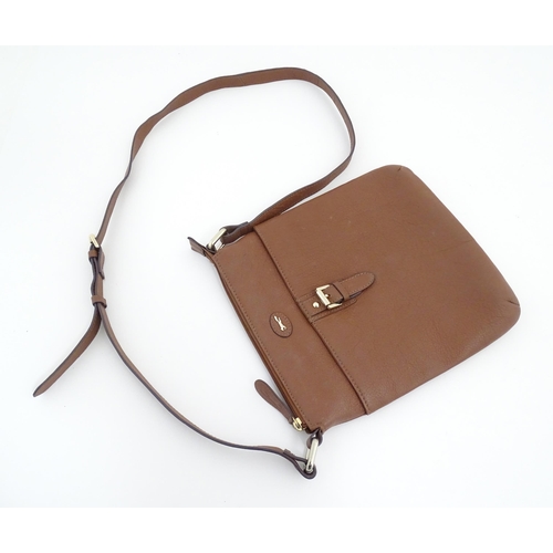 1401 - Vintage fashion / clothing: A Paul Costelloe leather cross body handbag in tan with buckle detail on... 