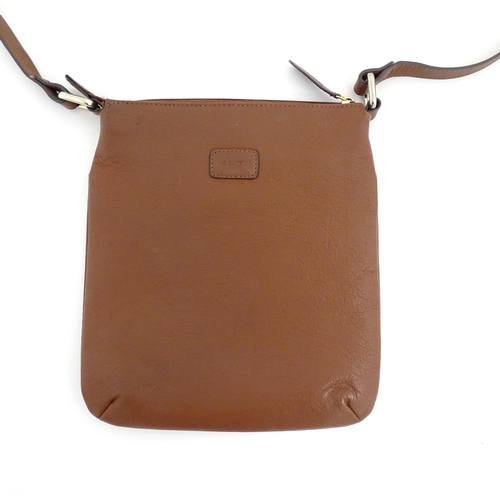 1401 - Vintage fashion / clothing: A Paul Costelloe leather cross body handbag in tan with buckle detail on... 