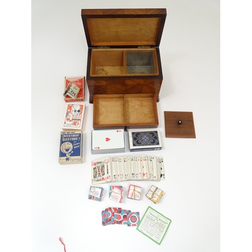 1457 - Toys: An early 20thC games compendium / box, the exterior with chequered mahogany panelling, fitted ... 