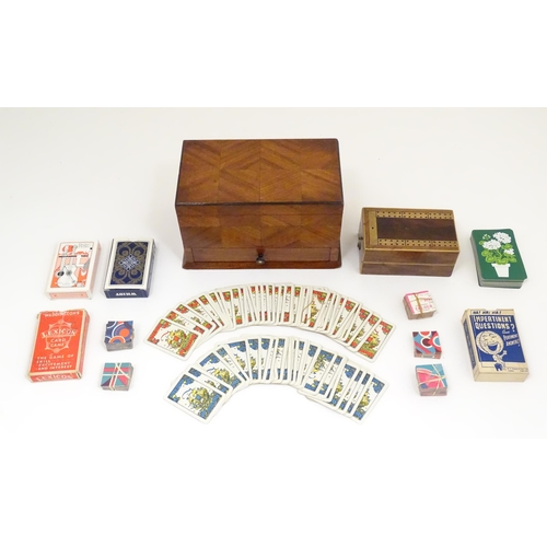 1457 - Toys: An early 20thC games compendium / box, the exterior with chequered mahogany panelling, fitted ... 