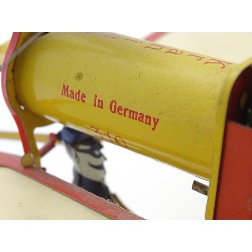 1473 - Toy: A 20thC German tinplate clockwork monoplane / aeroplane, Kranich 310. Made by Dusseldorfer Blec... 