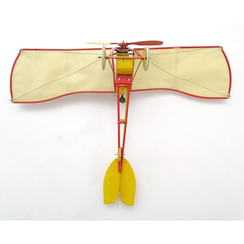 1473 - Toy: A 20thC German tinplate clockwork monoplane / aeroplane, Kranich 310. Made by Dusseldorfer Blec... 