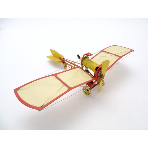 1473 - Toy: A 20thC German tinplate clockwork monoplane / aeroplane, Kranich 310. Made by Dusseldorfer Blec... 