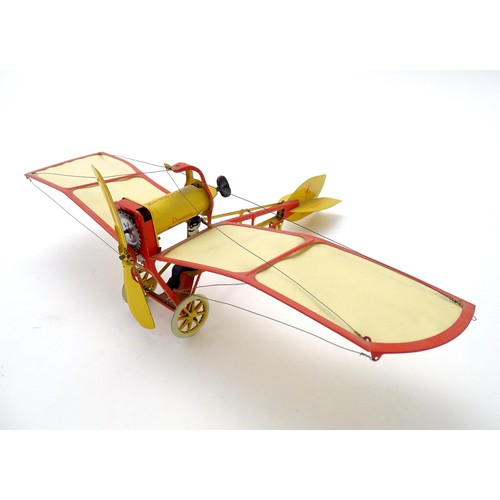 1473 - Toy: A 20thC German tinplate clockwork monoplane / aeroplane, Kranich 310. Made by Dusseldorfer Blec... 