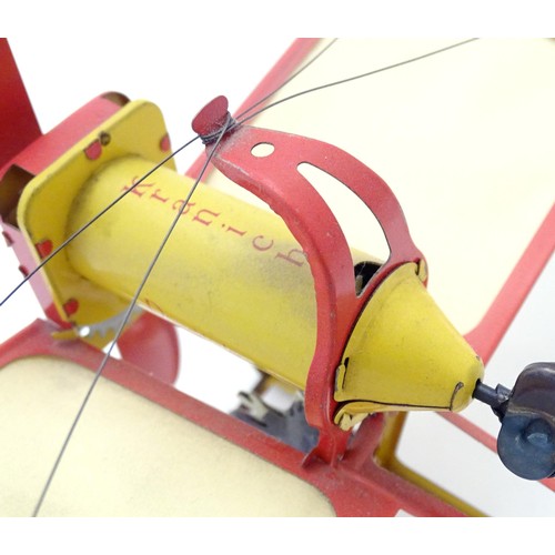 1473 - Toy: A 20thC German tinplate clockwork monoplane / aeroplane, Kranich 310. Made by Dusseldorfer Blec... 