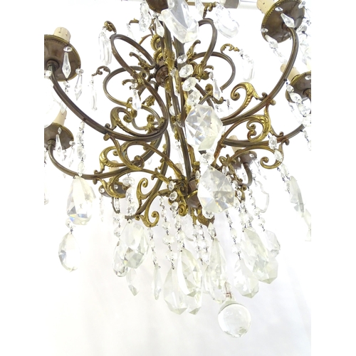 1563 - A late 19thC / early 20thC chandelier / electrolier / pendant light with 8 scrolling branches decora... 