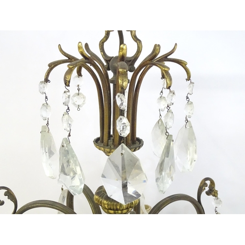 1563 - A late 19thC / early 20thC chandelier / electrolier / pendant light with 8 scrolling branches decora... 