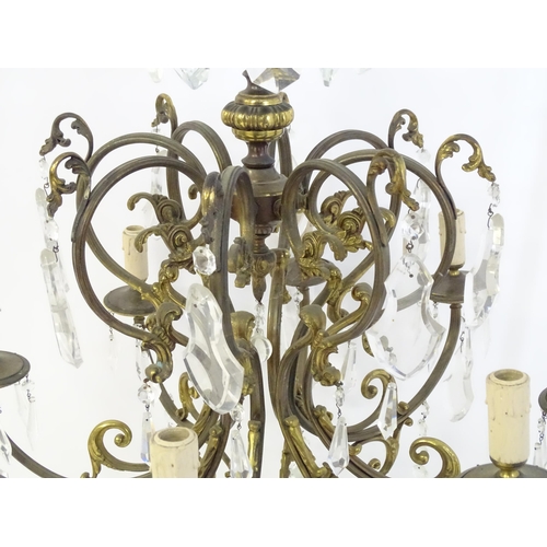 1563 - A late 19thC / early 20thC chandelier / electrolier / pendant light with 8 scrolling branches decora... 