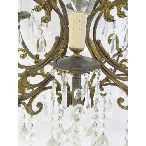 1563 - A late 19thC / early 20thC chandelier / electrolier / pendant light with 8 scrolling branches decora... 