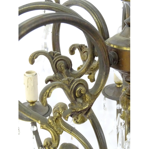 1563 - A late 19thC / early 20thC chandelier / electrolier / pendant light with 8 scrolling branches decora... 