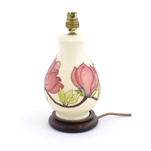 1576 - A Moorcroft table lamp decorated in the Pink Magnolia pattern. Approx. 10 1/2