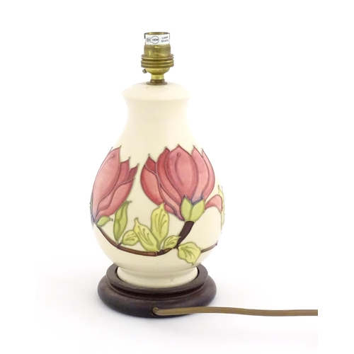 1576 - A Moorcroft table lamp decorated in the Pink Magnolia pattern. Approx. 10 1/2