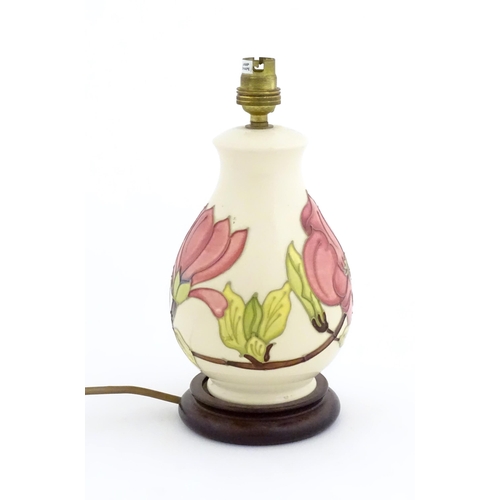 1576 - A Moorcroft table lamp decorated in the Pink Magnolia pattern. Approx. 10 1/2