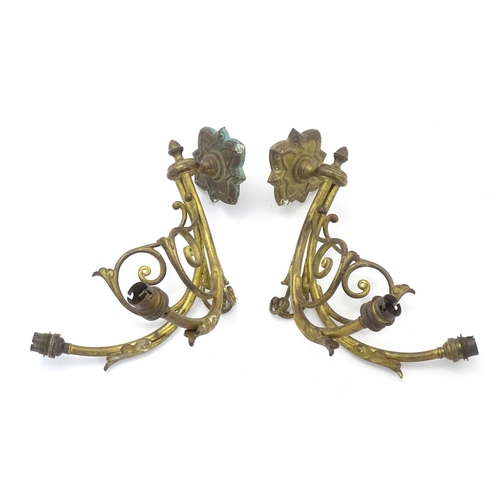 1585 - A pair of Arts & Crafts style brass double wall lights, each branch protruding approx 12