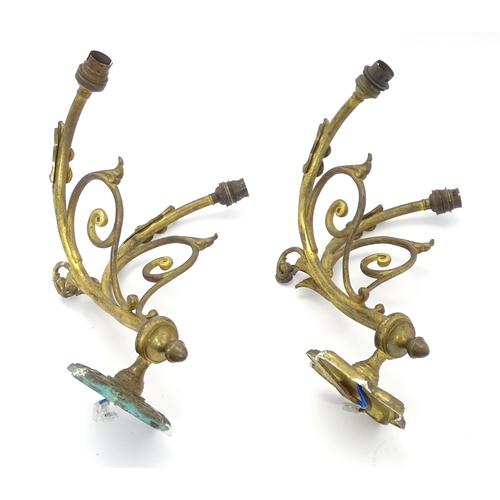 1585 - A pair of Arts & Crafts style brass double wall lights, each branch protruding approx 12