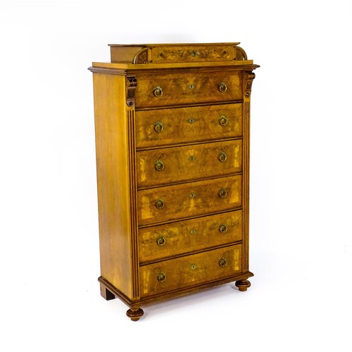 1593 - A late 19thC / early 20thC burr walnut tall boy / chest of drawers, the chest having an upper tier w... 