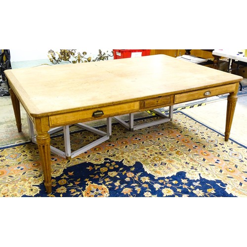 1599 - An exceptionally large, mid / late 20thC oak dining table / farmhouse kitchen table, with three frie... 