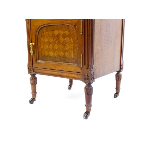 1636 - A late 19thC French kingwood cabinet, with a marble top above two short drawers and two panelled cup... 