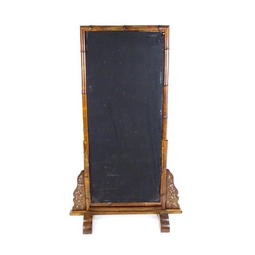 1643 - An early 20thC oriental bamboo screen, the screen having a bamboo surround with a fabric interior an... 