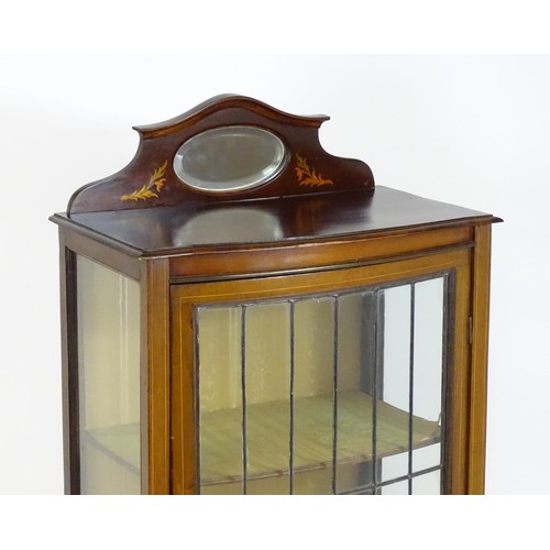 1650 - An Edwardian mahogany display cabinet with a small shaped mirrored upstand with satinwood marquetry ... 