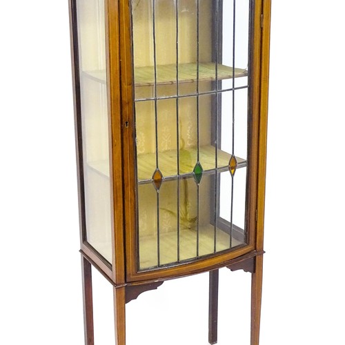 1650 - An Edwardian mahogany display cabinet with a small shaped mirrored upstand with satinwood marquetry ... 