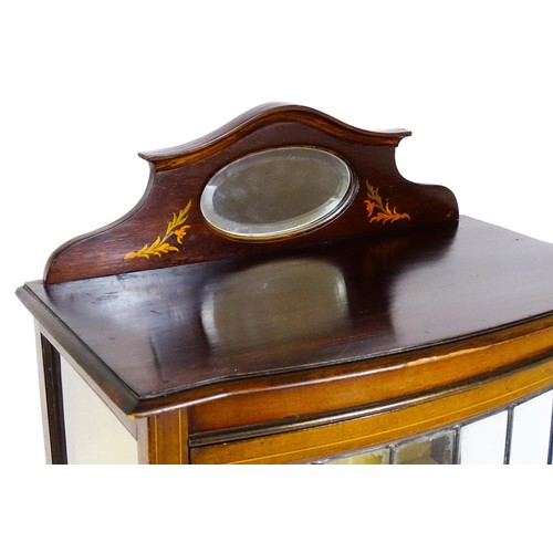 1650 - An Edwardian mahogany display cabinet with a small shaped mirrored upstand with satinwood marquetry ... 