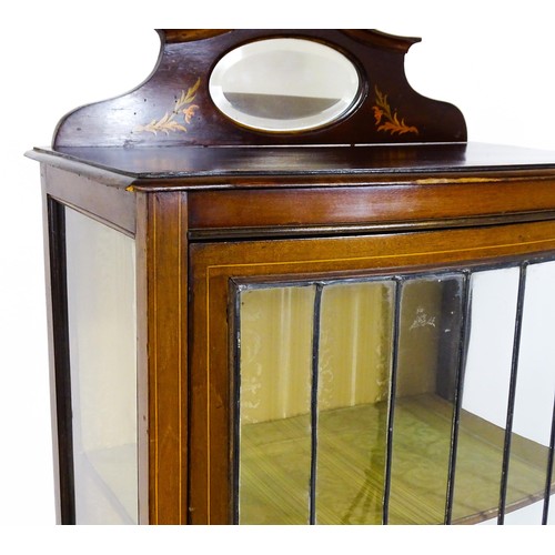 1650 - An Edwardian mahogany display cabinet with a small shaped mirrored upstand with satinwood marquetry ... 