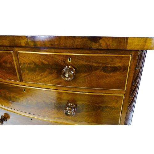 1653 - A Victorian bow fronted chest of drawers, comprising two short over three long drawers with turned w... 