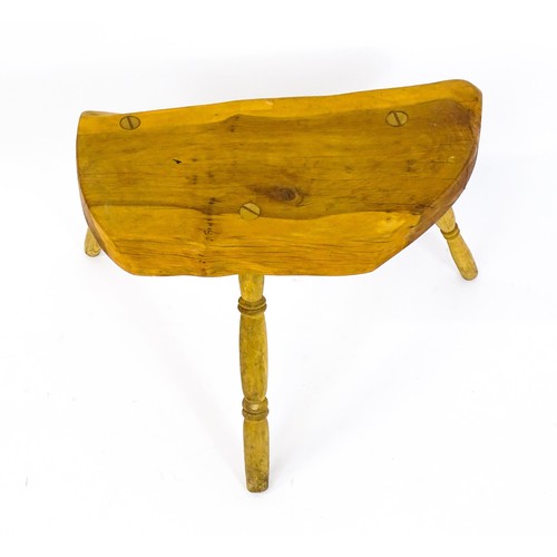 1664 - A mid / late 20th stool , with a yew wood seat raised on three turned tapering legs. 21