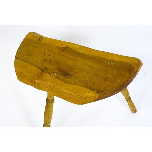 1664 - A mid / late 20th stool , with a yew wood seat raised on three turned tapering legs. 21