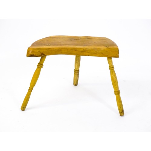 1664 - A mid / late 20th stool , with a yew wood seat raised on three turned tapering legs. 21