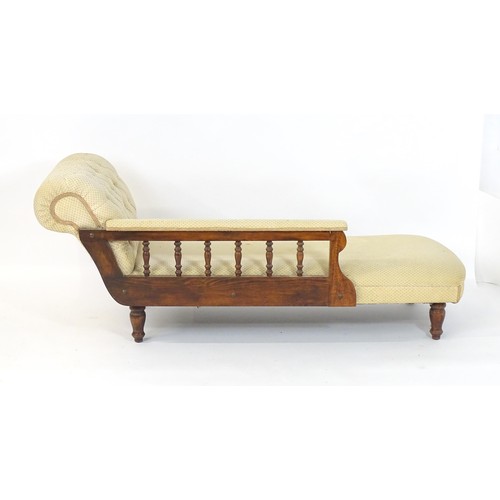 1675 - An early / mid 20thC chaise longue with a deep buttoned scrolled arm and a turned wooden gallery to ... 