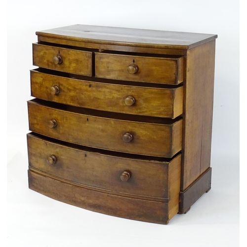 1676 - A 19thC mahogany bow fronted chest of drawers, comprising two short over three long drawers with tur... 