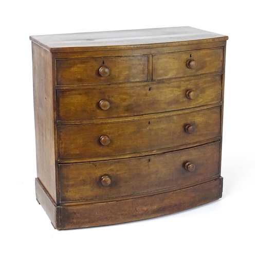 1676 - A 19thC mahogany bow fronted chest of drawers, comprising two short over three long drawers with tur... 