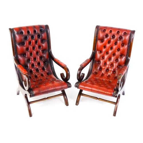 1678 - A pair of deep buttoned leather armchairs with mahogany frames, scrolled backs and scrolled arms, st... 