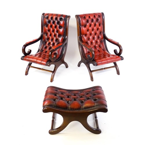 1678 - A pair of deep buttoned leather armchairs with mahogany frames, scrolled backs and scrolled arms, st... 