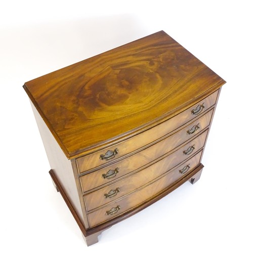 1680 - A 20thC mahogany chest of drawers with a bow front and four long drawers raised on shaped bracket fe... 