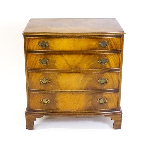 1680 - A 20thC mahogany chest of drawers with a bow front and four long drawers raised on shaped bracket fe... 