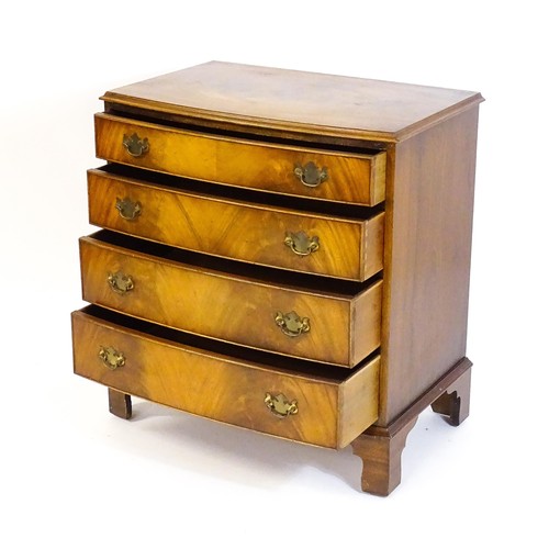 1680 - A 20thC mahogany chest of drawers with a bow front and four long drawers raised on shaped bracket fe... 