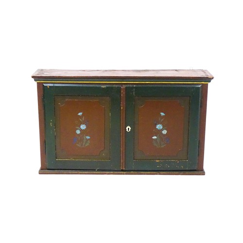 1682 - A late 19thC hanging cabinet with two panelled painted doors and opening to show a fitted interior w... 