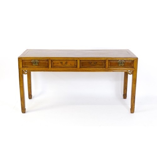 1685 - An early 20thC oriental elm sideboard, with four short drawers to the frieze and carved scrolls tot ... 