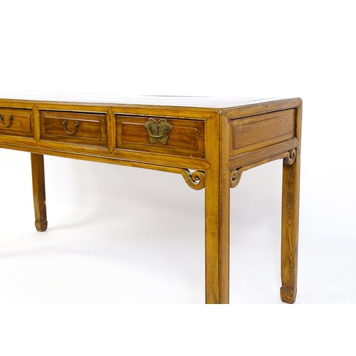 1685 - An early 20thC oriental elm sideboard, with four short drawers to the frieze and carved scrolls tot ... 