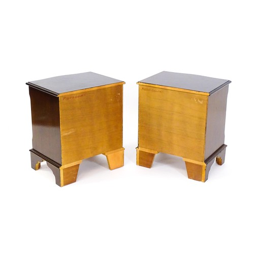 1686 - A pair of mahogany veneered bedside cabinets with serpentine shaped tops and each having three short... 