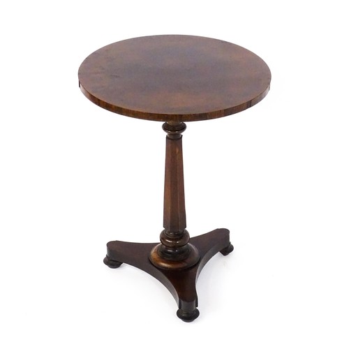 1688 - A mid 19thC rosewood occasional table, with a circular top above a canted pedestal and triform base ... 