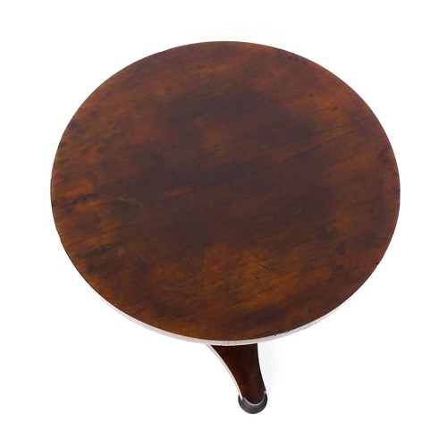 1688 - A mid 19thC rosewood occasional table, with a circular top above a canted pedestal and triform base ... 