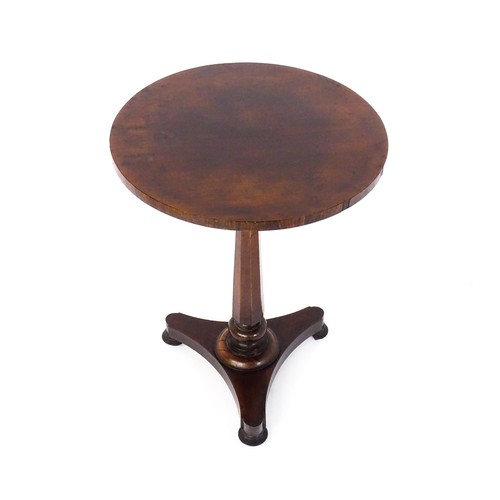 1688 - A mid 19thC rosewood occasional table, with a circular top above a canted pedestal and triform base ... 