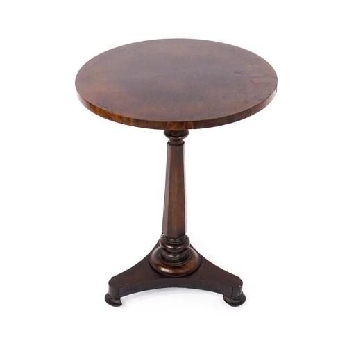 1688 - A mid 19thC rosewood occasional table, with a circular top above a canted pedestal and triform base ... 