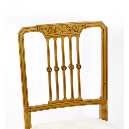 1690 - A pair of late 19thC / early 20thC satinwood side chairs, with marquetry and penwork decoration,  ba... 