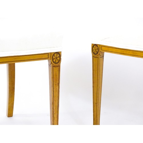 1690 - A pair of late 19thC / early 20thC satinwood side chairs, with marquetry and penwork decoration,  ba... 